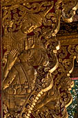 Wat Xieng Thong temple in Luang Prabang, Laos. the Ho Tai, the library. Detail of the console of the roof. 